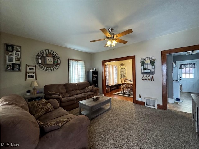 living room with carpet floors and ceiling fan