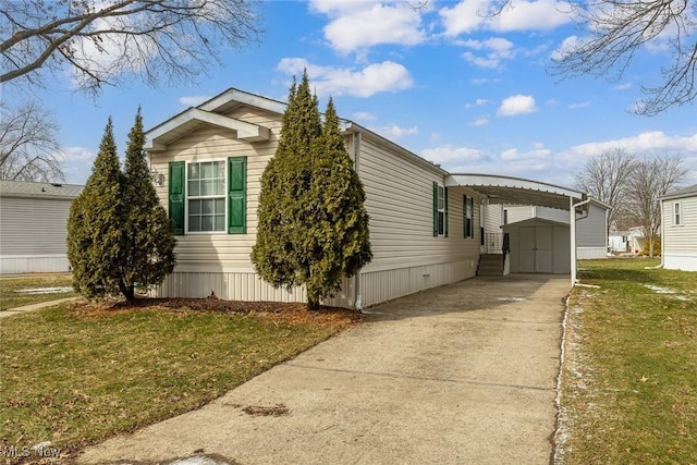 view of front facade featuring a shed, a front yard, and a carport