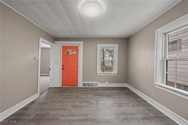 entryway featuring crown molding and wood-type flooring