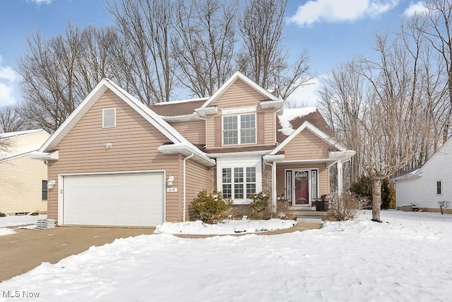 traditional-style house with brick siding and an attached garage