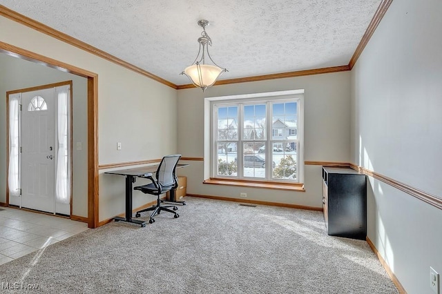 office area with a textured ceiling, crown molding, visible vents, and light colored carpet