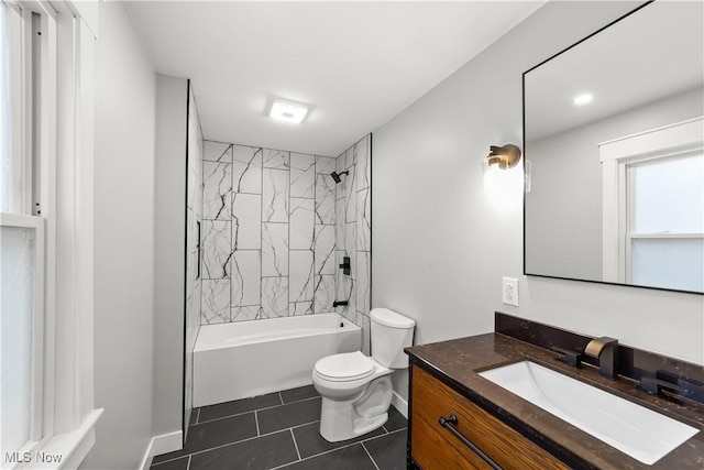 full bathroom with vanity, tile patterned flooring, tiled shower / bath combo, and toilet