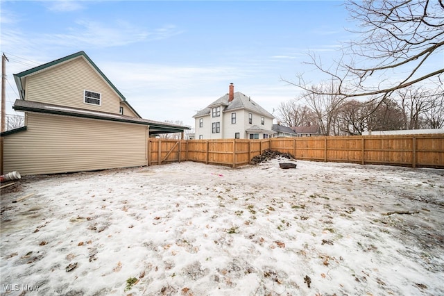 view of yard layered in snow