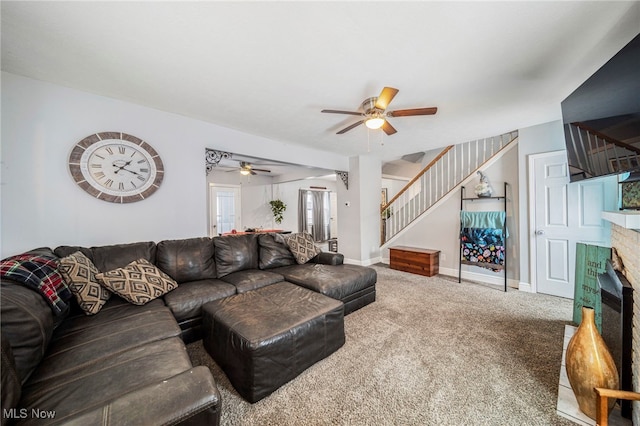 living room featuring carpet flooring and ceiling fan