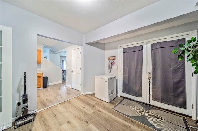 entrance foyer with light hardwood / wood-style flooring