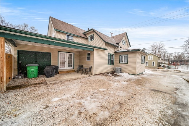 back of house featuring a patio area and central air condition unit