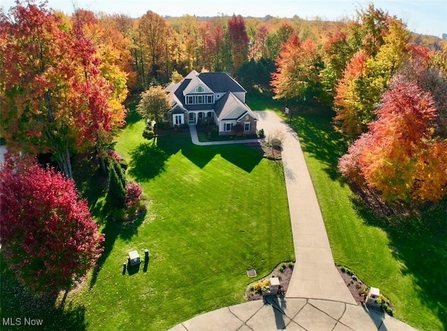 aerial view featuring a wooded view