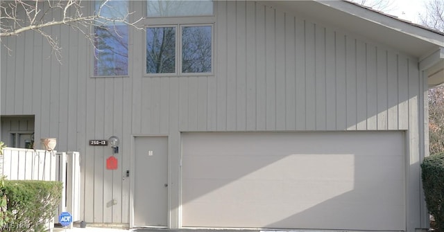 view of side of home with a garage