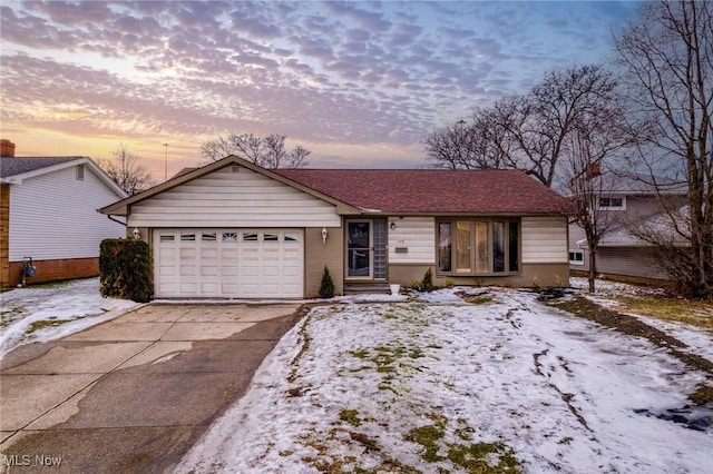 single story home featuring a garage