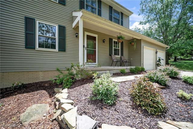 entrance to property with a porch and a garage