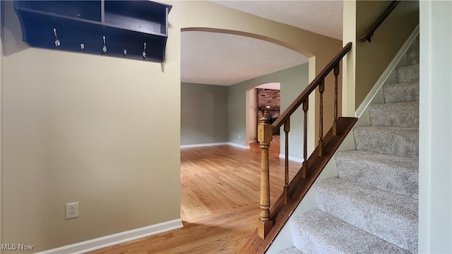 stairway with wood-type flooring