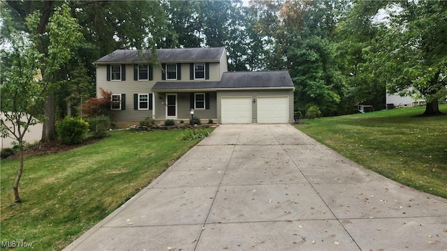 colonial house with a garage and a front yard