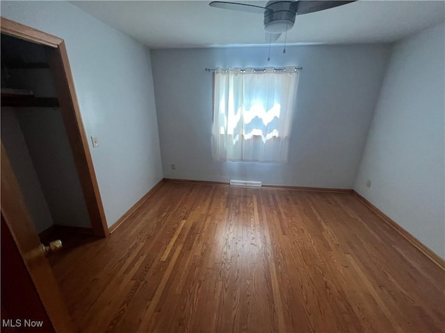 unfurnished bedroom with hardwood / wood-style floors and ceiling fan