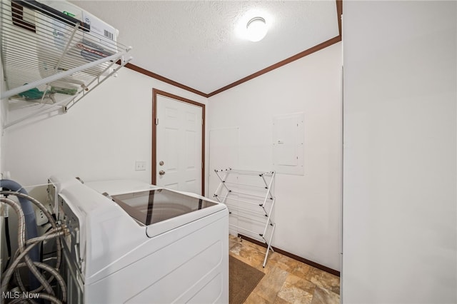 washroom with crown molding, separate washer and dryer, electric panel, and a textured ceiling