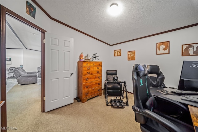 carpeted home office with lofted ceiling, ornamental molding, and a textured ceiling