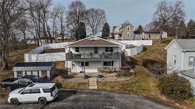 view of front of home featuring an outbuilding