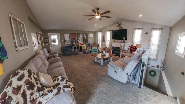 living room featuring lofted ceiling, carpet floors, and ceiling fan