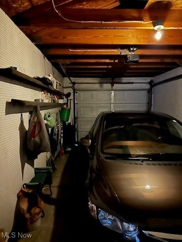 garage featuring a garage door opener