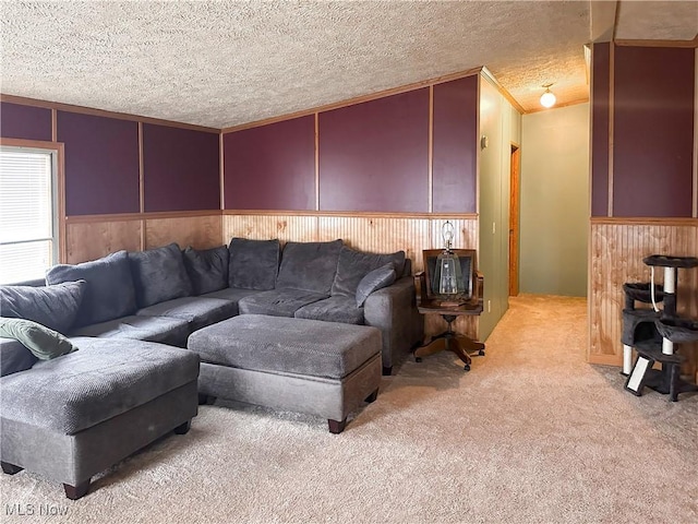 living room featuring crown molding, light colored carpet, wooden walls, and a textured ceiling