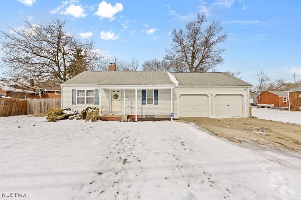 ranch-style house with a chimney, an attached garage, and fence