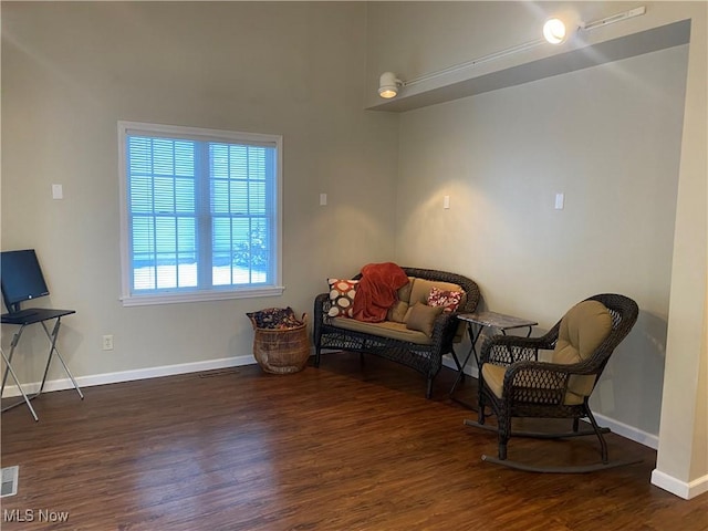 sitting room featuring dark hardwood / wood-style flooring