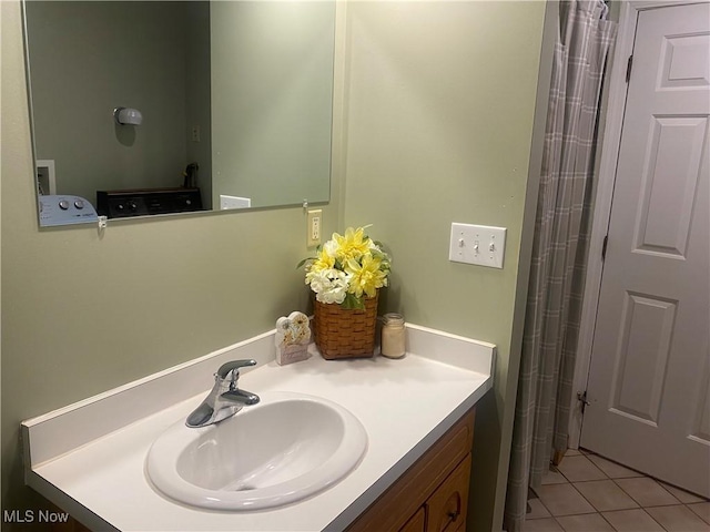 bathroom with tile patterned flooring and vanity