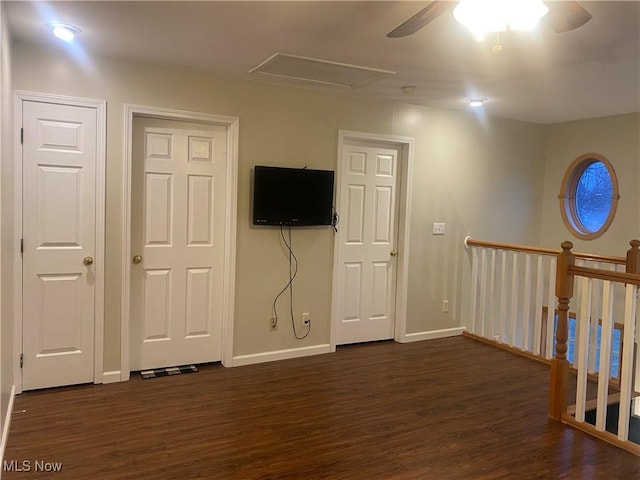 spare room with ceiling fan and dark hardwood / wood-style floors