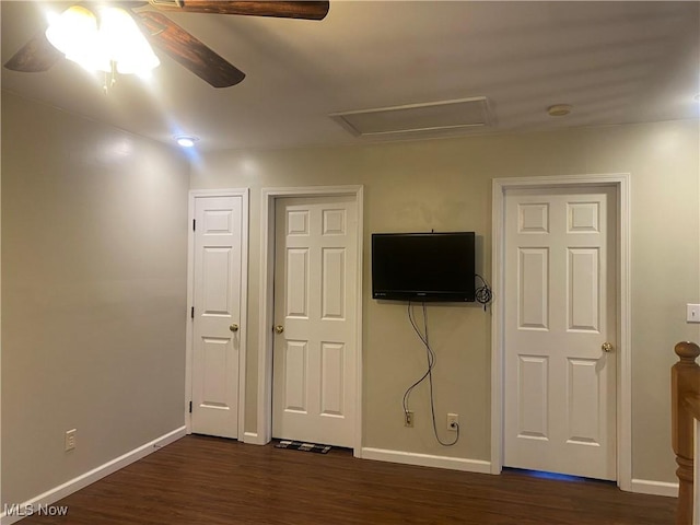 interior space with dark hardwood / wood-style floors and ceiling fan