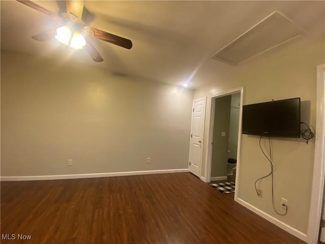 empty room featuring dark hardwood / wood-style flooring and ceiling fan