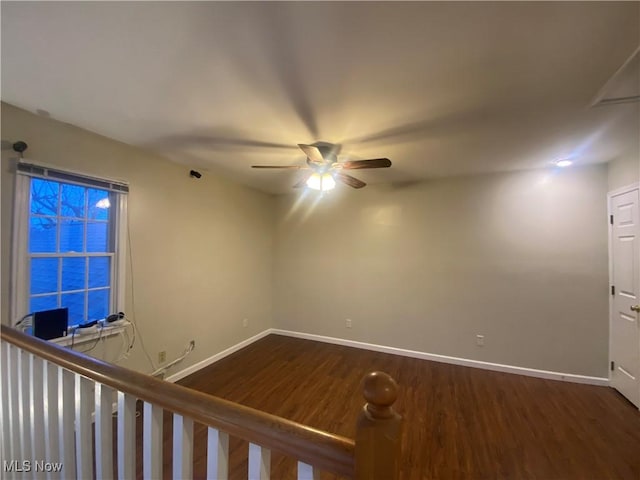 spare room featuring hardwood / wood-style flooring and ceiling fan