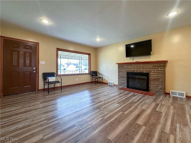 unfurnished living room with wood-type flooring