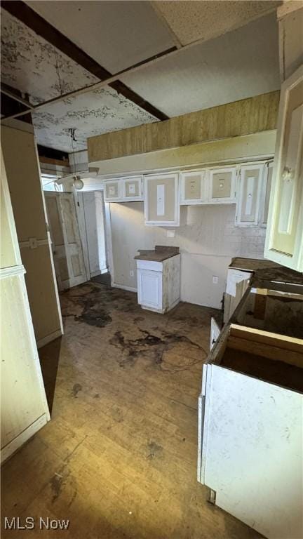 kitchen featuring white cabinetry