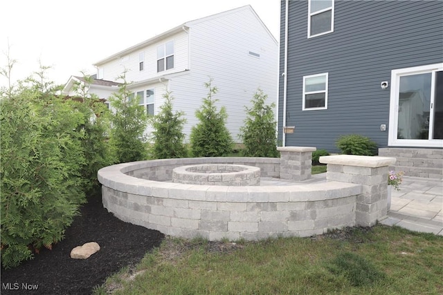 exterior space featuring a fire pit