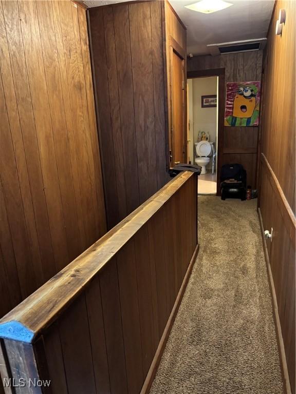 428 Foster Ave, Cambridge, OH 43725 - hall with wood walls and dark colored carpet