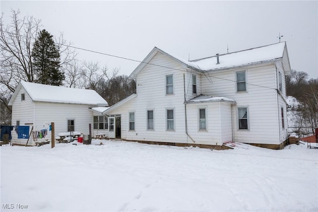 view of snow covered house