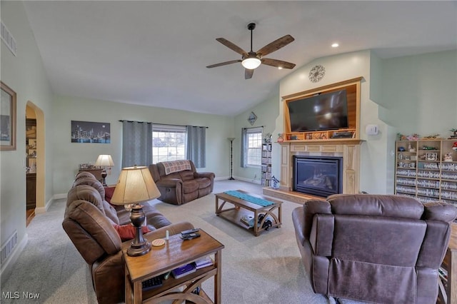 carpeted living room featuring lofted ceiling and ceiling fan