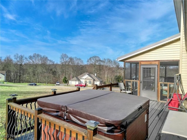 deck with a hot tub and a sunroom