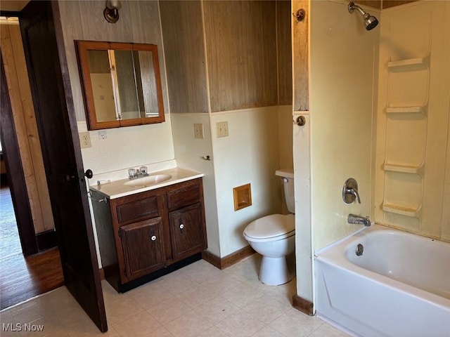 full bathroom featuring vanity, toilet, and washtub / shower combination