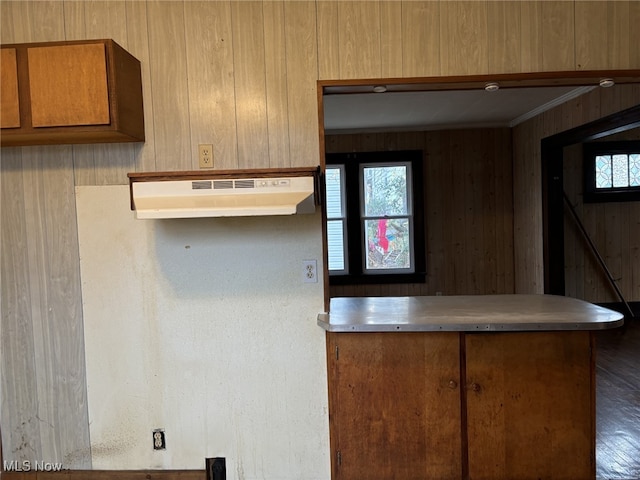 kitchen with ornamental molding and a wall unit AC