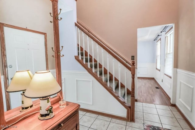 stairs with tile patterned floors