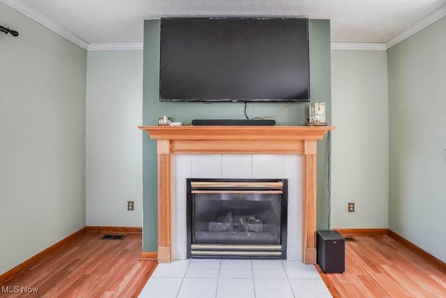 room details featuring hardwood / wood-style flooring, a fireplace, and ornamental molding