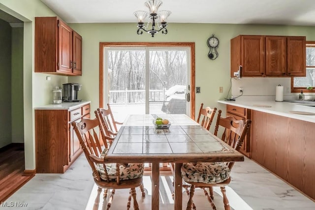 dining space featuring an inviting chandelier