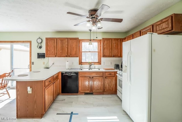 kitchen featuring ceiling fan, white appliances, kitchen peninsula, and sink