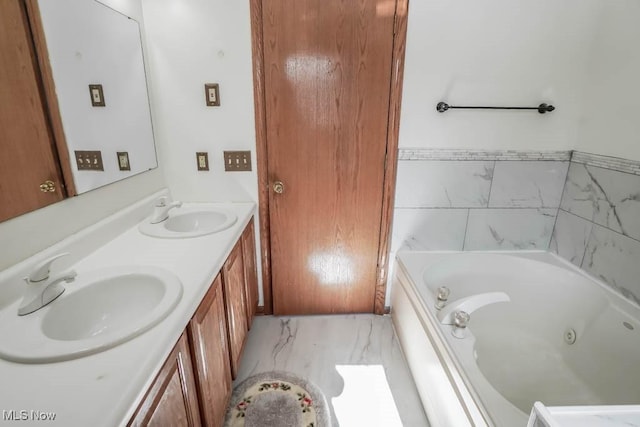 bathroom featuring vanity and a bathtub