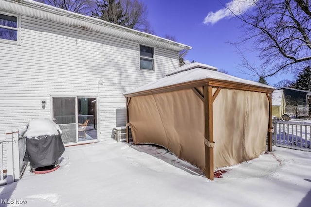 snow covered property featuring a gazebo