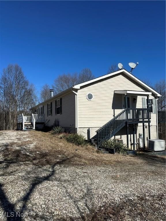 view of side of home with cooling unit