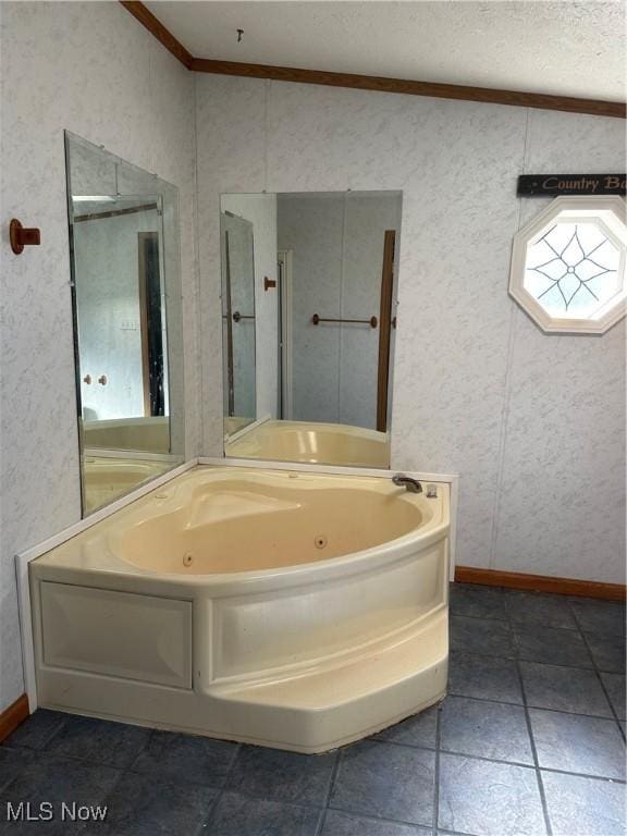 bathroom featuring crown molding, a textured ceiling, and a tub to relax in