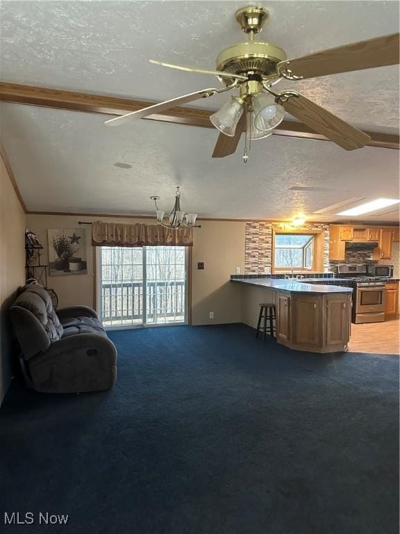 unfurnished living room with dark carpet, ceiling fan, vaulted ceiling, and a textured ceiling