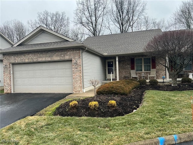 single story home with a garage and a front yard