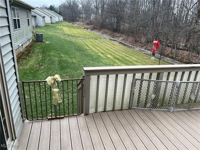 6695 Clingan Rd Unit 26, Poland, OH 44514 - deck with central air condition unit and a yard